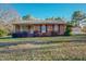 Charming brick ranch-style home with a well-maintained lawn and detached garage at 604 Orange Factory Road, Bahama, NC 27503
