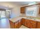 Kitchen view with a double sink and outdoor view through the window at 604 Orange Factory Road, Bahama, NC 27503