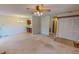 Open-concept living room and dining area with hardwood floors and modern lighting fixtures at 604 Orange Factory Road, Bahama, NC 27503