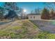 View of a shed from across a grass-covered backyard at 604 Orange Factory Road, Bahama, NC 27503