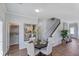 This dining room offers stylish decor, wood floors, and convenient access to the kitchen and pantry at 61 Atherton Circle, Angier, NC 27501