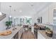 Open kitchen with granite countertops and stainless steel appliances overlooking the living room at 61 Atherton Circle, Angier, NC 27501