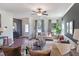 Spacious living room with wood floors, stylish furniture, and abundant natural light at 61 Atherton Circle, Angier, NC 27501