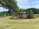 Entrance to Cambridge Reserve with stone column and landscaping at 62 Atherton Circle, Angier, NC 27501