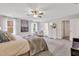 Spacious bedroom featuring plush carpeting, natural light, and a calming color palette at 62 Atherton Circle, Angier, NC 27501