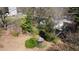 Aerial view of the home surrounded by lush greenery and featuring a gazebo in the yard at 620 Sunnybrook Rd, Raleigh, NC 27610