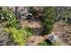 Aerial view featuring a quaint gazebo and an overview of the property's lush surroundings at 620 Sunnybrook Rd, Raleigh, NC 27610