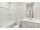 Clean, well-lit bathroom with a shower-tub combination and modern vanity at 621 White Birch Ln, Angier, NC 27501