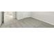 Well-lit bedroom features neutral carpeting, with an open doorway leading to another room at 621 White Birch Ln, Angier, NC 27501