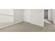 Bedroom with neutral walls, gray carpet, and door leading to the hallway at 621 White Birch Ln, Angier, NC 27501