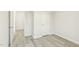Clean bedroom with neutral walls and laminate flooring, door to hall at 621 White Birch Ln, Angier, NC 27501