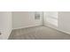 Cozy bedroom featuring gray carpet and a window with blinds for natural light and privacy at 621 White Birch Ln, Angier, NC 27501