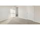 Bedroom with carpet and two interior doors at 621 White Birch Ln, Angier, NC 27501