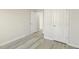 Bedroom with two interior doors and laminate flooring at 621 White Birch Ln, Angier, NC 27501