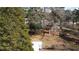 Large backyard with mature trees surrounding the home and a utility shed at 640 Sunnybrook Rd, Raleigh, NC 27610