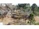 Expansive lot surrounded by lush, mature trees offers privacy and a serene setting at 640 Sunnybrook Rd, Raleigh, NC 27610