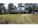 Charming single-story brick home with white trim, a spacious yard, and a private driveway at 640 Sunnybrook Rd, Raleigh, NC 27610