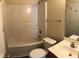 Cozy bathroom featuring a shower and tub combo with a single sink vanity at 70 Ariel St, Lillington, NC 27546