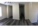 Neutral, freshly painted open living room with modern gray floors, bright lighting, and easy access at 70 Ariel St, Lillington, NC 27546