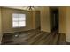 Living room features light-filled windows, neutral paint, modern flooring, and an open layout at 70 Ariel St, Lillington, NC 27546