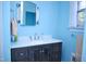 Bright bathroom with a vanity, modern fixtures, and a large mirror at 711 Evergreen Rd, Rocky Mount, NC 27803