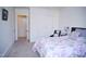 Bright bedroom featuring a floral comforter, closet with sliding doors, and modern decor at 711 Evergreen Rd, Rocky Mount, NC 27803
