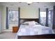 Bright bedroom with a ceiling fan, many windows, and curtains at 711 Evergreen Rd, Rocky Mount, NC 27803
