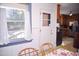 Sunlit breakfast nook with table, chairs, and a view of the outdoor scenery at 711 Evergreen Rd, Rocky Mount, NC 27803