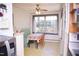 Cozy breakfast nook offers natural light, table, chairs, and ceiling fan at 711 Evergreen Rd, Rocky Mount, NC 27803