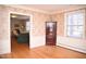 Elegant dining area with hardwood floors, wainscoting, and decorative wallpaper at 711 Evergreen Rd, Rocky Mount, NC 27803