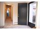 Entryway with an open door looking into a carpeted hallway and a tile floor at 711 Evergreen Rd, Rocky Mount, NC 27803