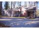 Brick ranch house with an enclosed porch and ramp to the front door at 711 Evergreen Rd, Rocky Mount, NC 27803