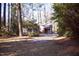 Charming brick home nestled among mature trees and landscaping at 711 Evergreen Rd, Rocky Mount, NC 27803