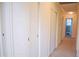 Bright hallway featuring built-in storage cabinets and access to bedrooms at 711 Evergreen Rd, Rocky Mount, NC 27803