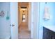 Hallway with consistent paint, towel racks, and a view leading into other rooms at 711 Evergreen Rd, Rocky Mount, NC 27803