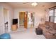 Spacious living room featuring stairs, multiple doorways, and a comfortable sofa at 711 Evergreen Rd, Rocky Mount, NC 27803