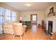 Spacious living room featuring hardwood floors, neutral paint, and a decorative fireplace at 711 Evergreen Rd, Rocky Mount, NC 27803