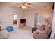 Bright living room with neutral carpet, featuring a recliner sofa and TV on a wooden media console at 711 Evergreen Rd, Rocky Mount, NC 27803