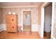 Living room with hardwood floors, floral wallpaper and period furniture at 711 Evergreen Rd, Rocky Mount, NC 27803