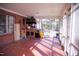 Covered brick patio featuring a vintage outdoor grill and lots of natural light at 711 Evergreen Rd, Rocky Mount, NC 27803