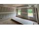 Bright bedroom showcasing smooth walls, dual windows, and a tray ceiling, ready for customization at 766 Old Station Pointe, Angier, NC 27501