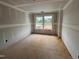 Bedroom featuring two windows offering natural light and a view of the neighborhood, under construction at 766 Old Station Pointe, Angier, NC 27501