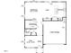 Open floor plan showing the layout of the first floor with a kitchen, gathering area, and garage at 766 Old Station Pointe, Angier, NC 27501