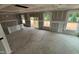 Spacious living room featuring a large window and sliding glass door, under construction at 766 Old Station Pointe, Angier, NC 27501