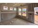 Living room with windows offering natural light and a view of the neighborhood at 766 Old Station Pointe, Angier, NC 27501