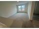 Spacious loft with two windows offering natural light and plush carpeting for comfort and style at 766 Old Station Pointe, Angier, NC 27501