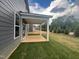 Spacious covered patio ideal for outdoor relaxation and entertaining at 766 Old Station Pointe, Angier, NC 27501