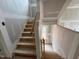 Staircase under construction featuring a natural wood staircase and light at 766 Old Station Pointe, Angier, NC 27501
