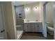Modern bathroom with a glass enclosed shower, dual vanity with sleek countertops, and stylish lighting at 771 Old Station Pointe, Angier, NC 27501