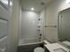 A bright bathroom features a tub, shower, and modern vanity at 771 Old Station Pointe, Angier, NC 27501